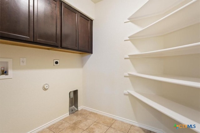1328 Blue Leaf Dr, Temple, TX 76502 - laundry room featuring baseboards, hookup for a washing machine, gas dryer hookup, cabinet space, and hookup for an electric dryer