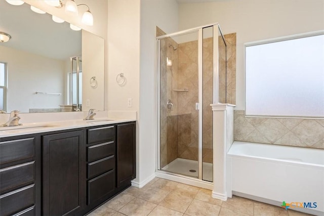 1328 Blue Leaf Dr, Temple, TX 76502 - bathroom with a shower stall, a sink, and tile patterned flooring