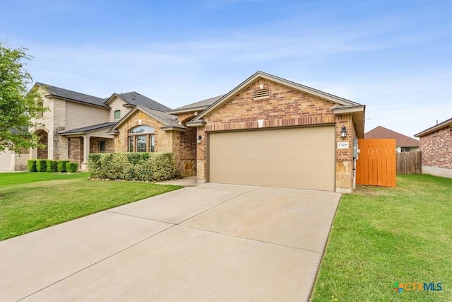 1328 Blue Leaf Dr, Temple, TX 76502 - single story home featuring brick siding, a garage, fence, and concrete driveway