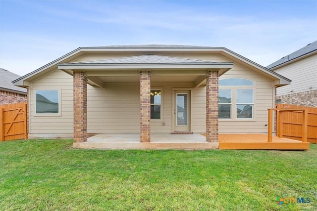 1328 Blue Leaf Dr, Temple, TX 76502 - back of property featuring a yard, a patio, fence, and a wooden deck