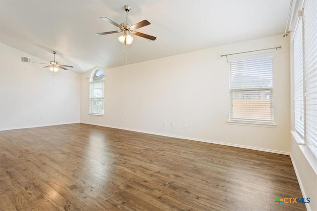 1328 Blue Leaf Dr, Temple, TX 76502 - spare room with a ceiling fan, wood finished floors, and vaulted ceiling