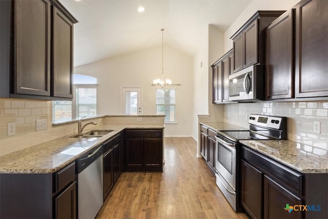 1328 Blue Leaf Dr, Temple, TX 76502 - kitchen with stainless steel appliances, an inviting chandelier, plenty of natural light, and a sink