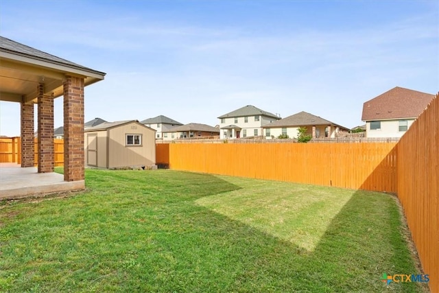 1328 Blue Leaf Dr, Temple, TX 76502 - view of yard with a patio, a fenced backyard, a storage shed, an outbuilding, and a residential view