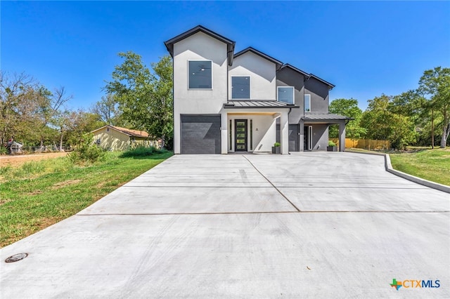 contemporary house featuring a front lawn