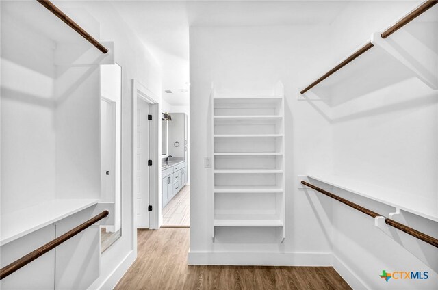 walk in closet featuring light wood-type flooring