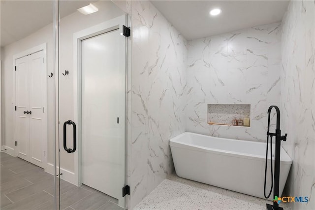 9 Mission Trce, New Braunfels, TX 78130 - full bath with a freestanding tub, recessed lighting, and a stall shower