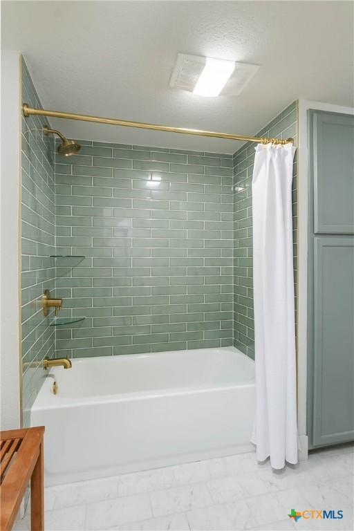 9 Mission Trce, New Braunfels, TX 78130 - full bath with shower / bath combo and marble finish floors