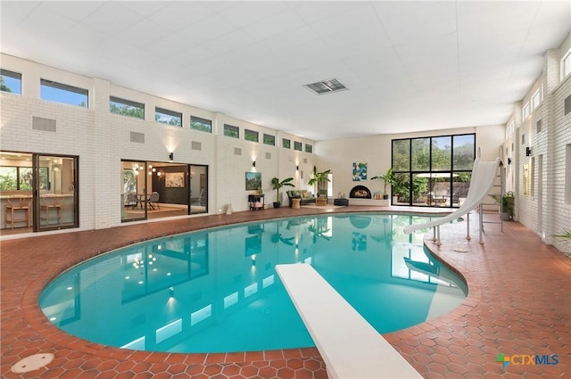 9 Mission Trce, New Braunfels, TX 78130 - indoor pool with a water slide and a diving board