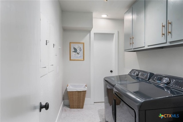 9 Mission Trce, New Braunfels, TX 78130 - laundry room with cabinet space, washing machine and clothes dryer, and light tile patterned flooring