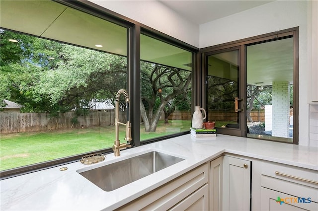 9 Mission Trce, New Braunfels, TX 78130 - kitchen with light stone counters and white cabinets