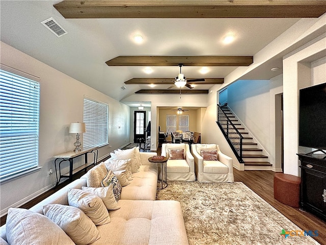 living room with lofted ceiling with beams, dark hardwood / wood-style flooring, and ceiling fan