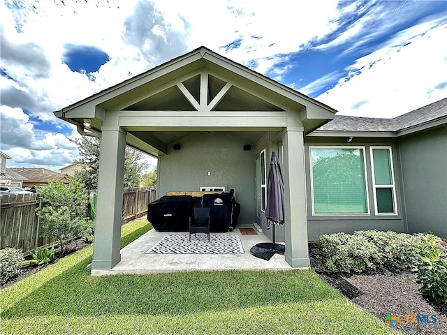 exterior space with a patio area and a yard