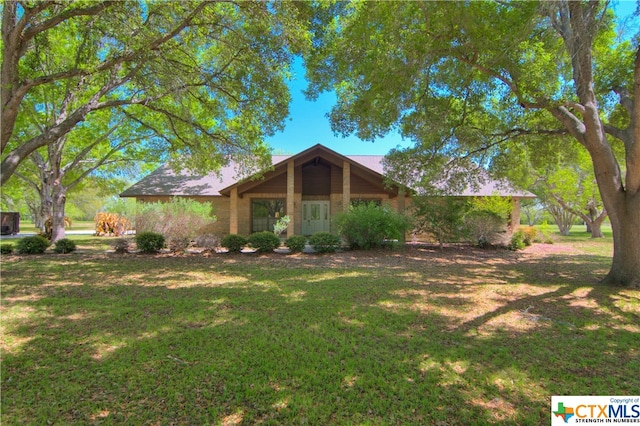 ranch-style home with a front lawn