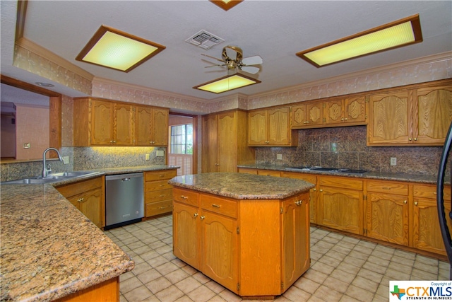 kitchen featuring stovetop, ornamental molding, sink, dishwasher, and a center island