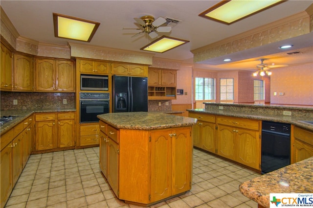 kitchen with ceiling fan, black appliances, crown molding, and a center island