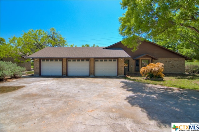 ranch-style home with a garage