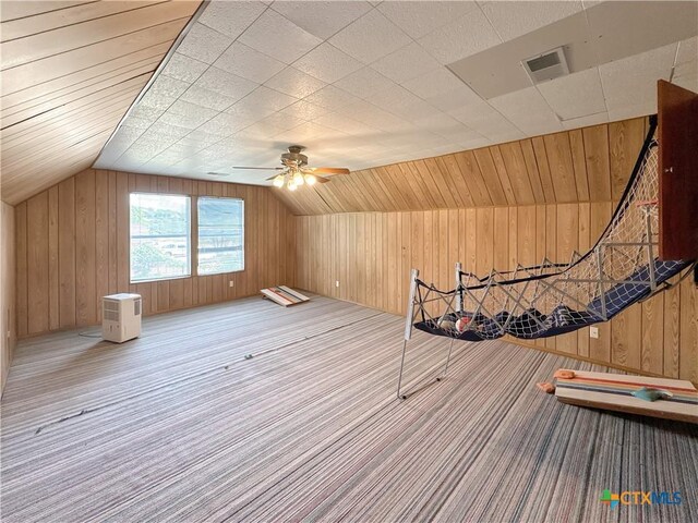 149 Gallagher Dr, Canyon Lake, TX 78133 - bonus room with wood walls, lofted ceiling, ceiling fan, and carpet flooring