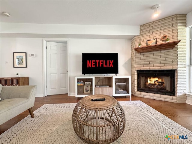 149 Gallagher Dr, Canyon Lake, TX 78133 - living room with wood finished floors and a brick fireplace