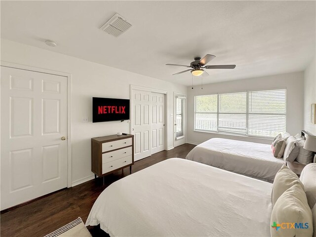149 Gallagher Dr, Canyon Lake, TX 78133 - bedroom featuring dark wood-style flooring and ceiling fan