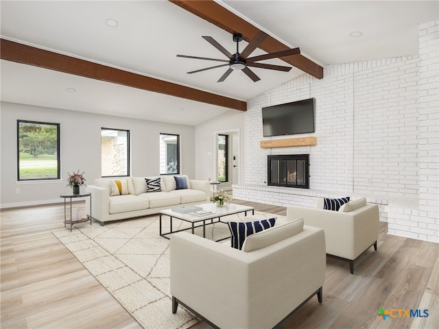1168 Mildred Lee Ln, Harker Heights, TX 76548 - living area featuring ceiling fan, wood finished floors, a fireplace, and healthy amount of natural light