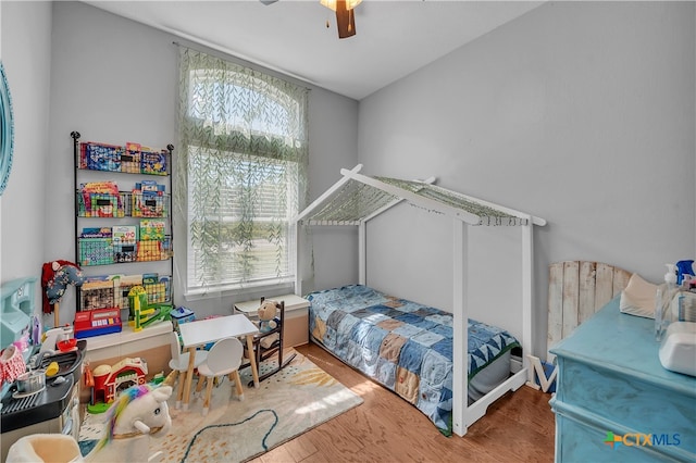 bedroom featuring ceiling fan and wood-type flooring