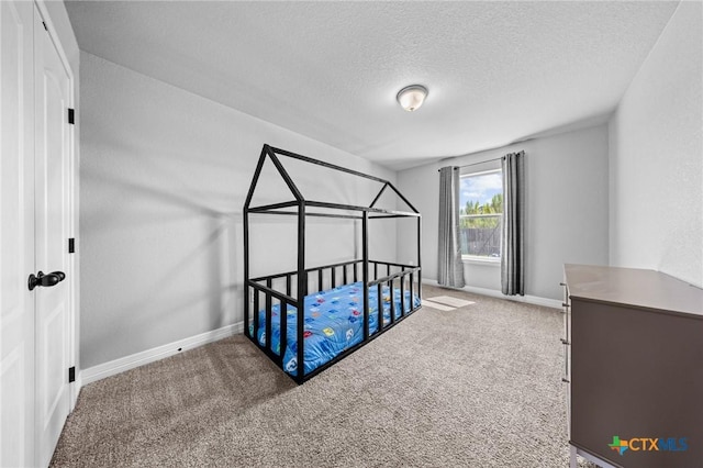 10103 Taylor Renee Dr, Killeen, TX 76542 - carpeted bedroom featuring baseboards and a textured ceiling