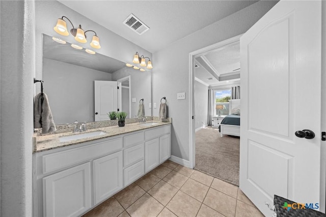 10103 Taylor Renee Dr, Killeen, TX 76542 - bathroom featuring double vanity, tile patterned floors, and a tray ceiling