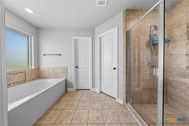 10103 Taylor Renee Dr, Killeen, TX 76542 - bathroom featuring a bath, a stall shower, and tile patterned floors