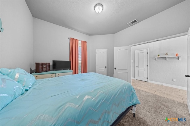 10103 Taylor Renee Dr, Killeen, TX 76542 - carpeted bedroom featuring tile patterned flooring and a textured ceiling