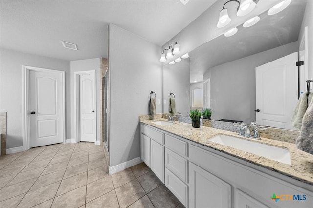 10103 Taylor Renee Dr, Killeen, TX 76542 - bathroom with double vanity, tile patterned floors, and a shower stall
