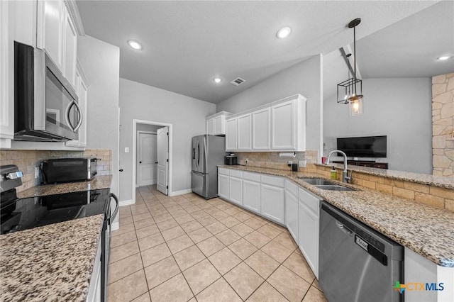 10103 Taylor Renee Dr, Killeen, TX 76542 - kitchen featuring stainless steel appliances, tasteful backsplash, white cabinets, light stone countertops, and recessed lighting