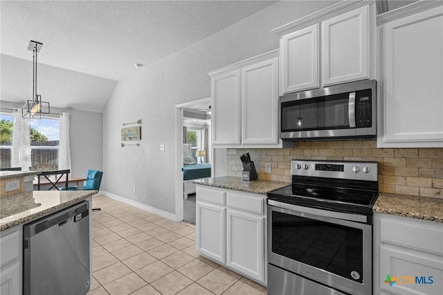 10103 Taylor Renee Dr, Killeen, TX 76542 - kitchen featuring stainless steel appliances, lofted ceiling, decorative backsplash, white cabinets, and healthy amount of natural light