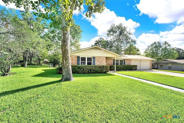 1802 Chestnut St, Floresville, TX 78114 - ranch-style house featuring a garage, concrete driveway, a front yard, and brick siding