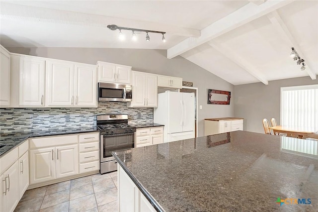 1802 Chestnut St, Floresville, TX 78114 - kitchen featuring appliances with stainless steel finishes, track lighting, and backsplash