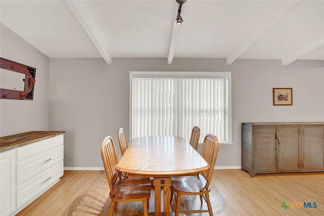 1802 Chestnut St, Floresville, TX 78114 - dining area with beam ceiling and light wood finished floors