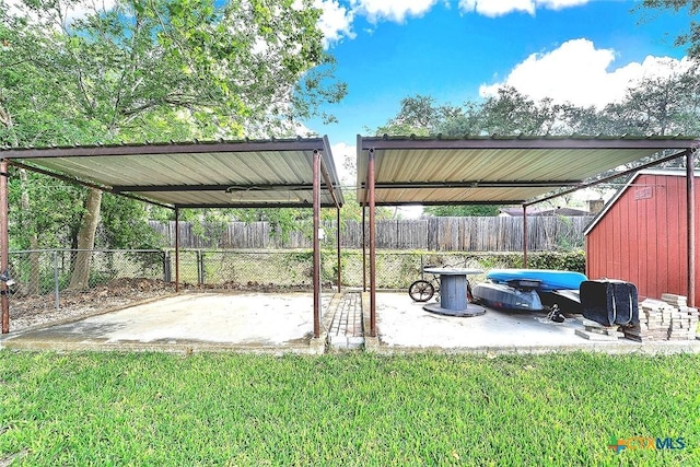 1802 Chestnut St, Floresville, TX 78114 - view of parking / parking lot featuring a carport, a fenced backyard, and a shed