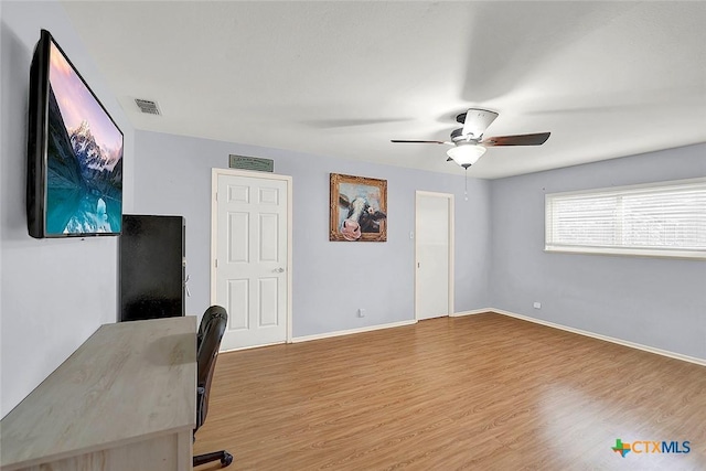 1802 Chestnut St, Floresville, TX 78114 - unfurnished office featuring ceiling fan and wood finished floors