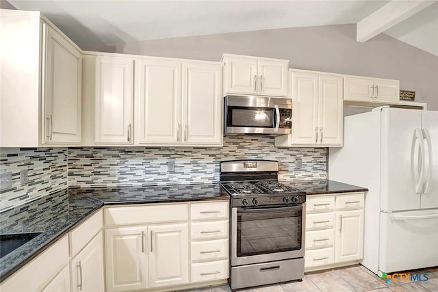 1802 Chestnut St, Floresville, TX 78114 - kitchen featuring stainless steel appliances, tasteful backsplash, dark stone countertops, and white cabinets