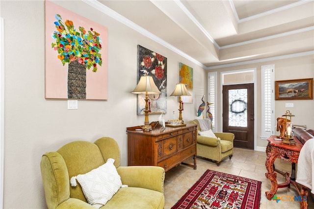 living area featuring ornamental molding, a tray ceiling, and tile patterned flooring