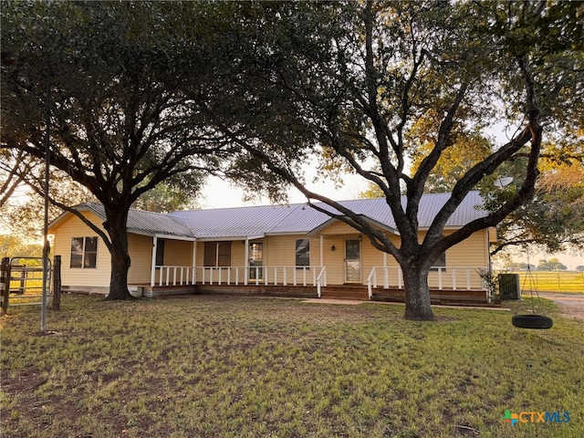 548 County Road 303, Shiner, TX 77984 - view of front of property with a porch and a metal roof
