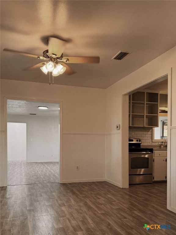 548 County Road 303, Shiner, TX 77984 - kitchen featuring electric range, ceiling fan, dark wood-type flooring, open shelves, and open floor plan