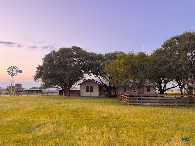 548 County Road 303, Shiner, TX 77984 - view of yard at dusk