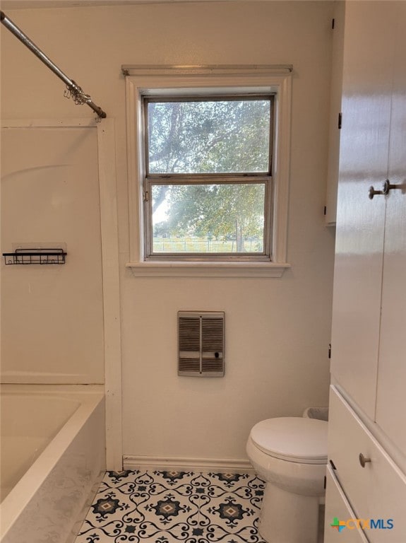 548 County Road 303, Shiner, TX 77984 - bathroom featuring tile patterned floors and heating unit