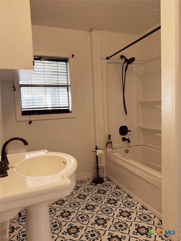 548 County Road 303, Shiner, TX 77984 - bathroom featuring shower / bath combination and tile patterned floors