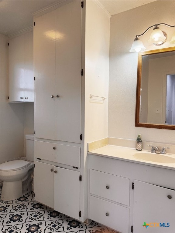 548 County Road 303, Shiner, TX 77984 - half bath featuring vanity, ornamental molding, and tile patterned floors