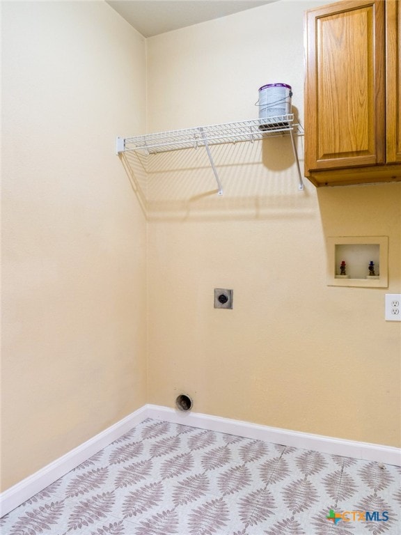 washroom with hookup for an electric dryer, light carpet, cabinets, and washer hookup