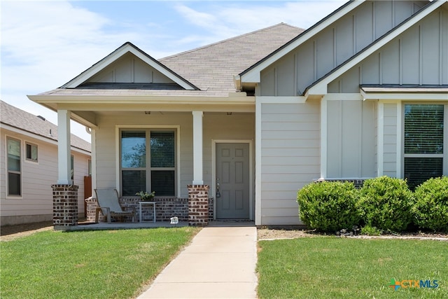 7628 Copper Creek Trl, Temple, TX 76502 - entrance to property featuring covered porch, board and batten siding, and a lawn