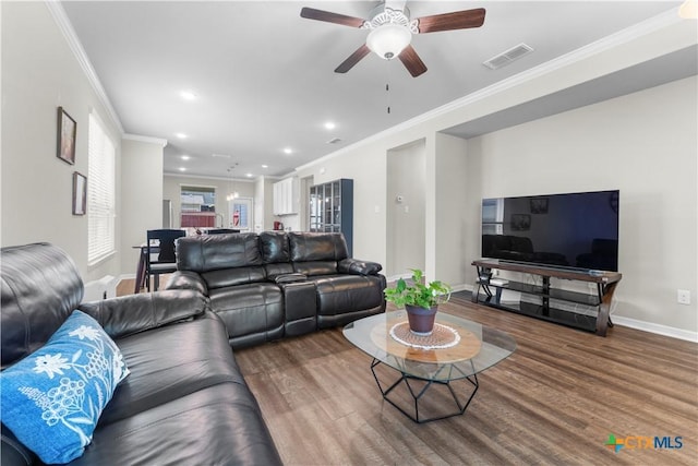 7628 Copper Creek Trl, Temple, TX 76502 - living room with crown molding, wood finished floors, a ceiling fan, baseboards, and recessed lighting