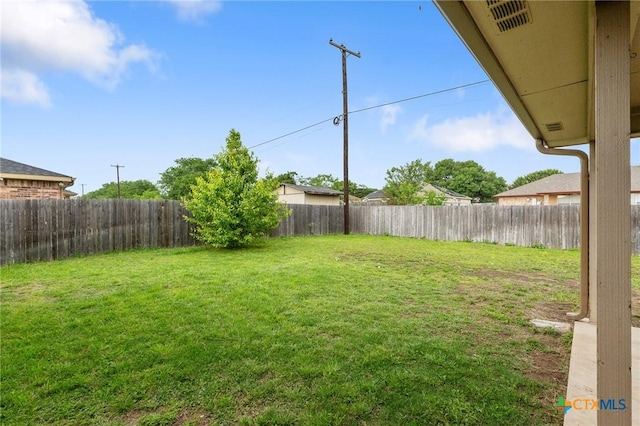 view of yard with a fenced backyard