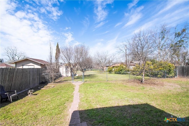 view of yard with a fenced backyard